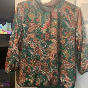 Green back ground with bright color paisley